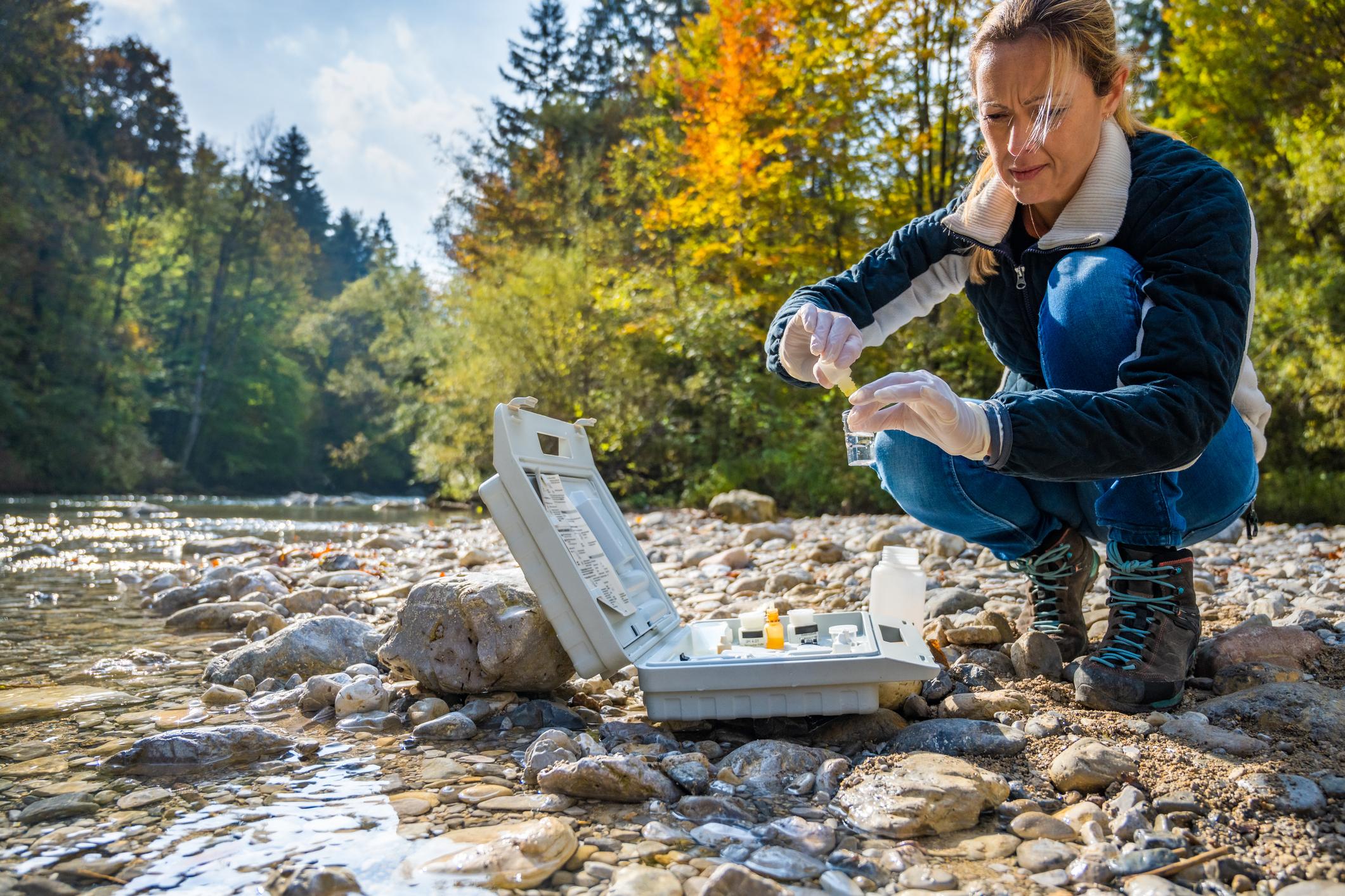 Water quality testing with Wyoming landscape in background